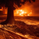 Flames consume a fast food restaurant as the Camp Fire tears through Paradise, Calif., on Thursday, Nov. 8, 2018.